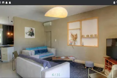 a living room with a couch and a tv at Maison CALM2 in Viggianello