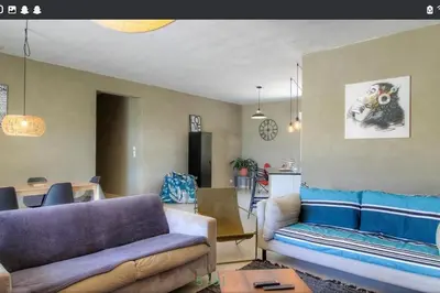 a living room with two couches and a table at Maison CALM2 in Viggianello