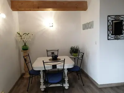 a dining room with a table and chairs at Casa Elena in Ajola