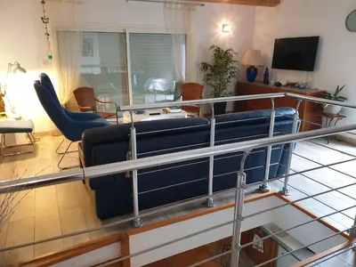 a living room with a couch and chairs at Casa Elena in Ajola