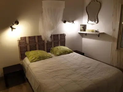 a bedroom with a large bed with two pillows at Casa Elena in Ajola