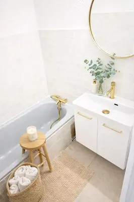 a bathroom with a white tub and a sink at Le Cocon de Lilie in San-Nicolao