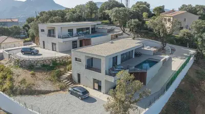 a house with a car parked in front of it at Villa Elora vue mer et piscine in Viggianello