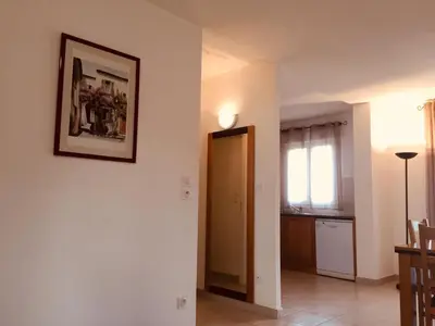 a living room with a picture on the wall at Résidence A NUCIOLA Les pieds dans l'eau Cervione Hte CORSE in Cervione