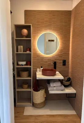 a bathroom with a sink and a mirror at Charmant studio Sanguinaires in Ajaccio