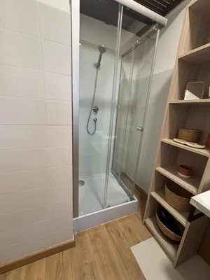 a shower room with a glass shower stall at Charmant studio Sanguinaires in Ajaccio