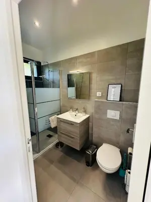 a bathroom with a toilet and a sink at N3 Maison T2 climatisé in Ajaccio