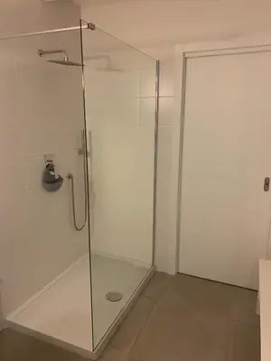 a shower with a glass door in a bathroom at CasaCanetto villa, suites et piscine chauffée in Bonifacio