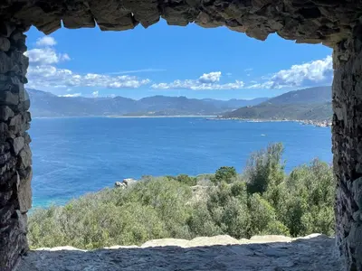 a view of the ocean through a window at Paillote Perchée à 180 ° sur la mer in Ajaccio