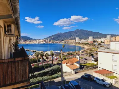 a view of a city and a body of water at Magnifique appartement avec balcon vue mer à l'entrée d'Ajaccio in Ajaccio