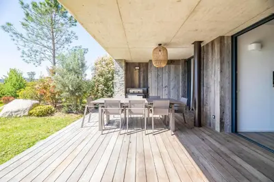 a living room with a couch and a coffee table at Casa Loua in Sainte-Lucie de Porto-Vecchio