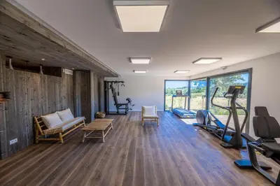 a sauna with a wooden tub in a room at Casa Loua in Sainte-Lucie de Porto-Vecchio