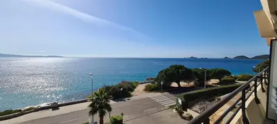 a view of the ocean from a balcony of a building at STUDIO LES CALANQUES in Ajaccio