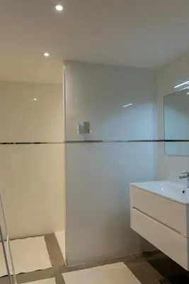a white bathroom with a sink and a mirror at Domaine d'Arca - Hugo 06 - 2 pers in Porto-Vecchio