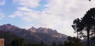 a view of a mountain range on a cloudy day at Casa in Castirla