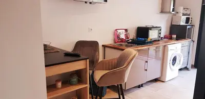 a kitchen with a washer and dryer next to a counter at Casa in Castirla