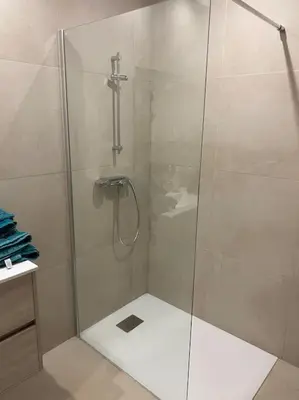 a shower with a glass door in a bathroom at Villa Pacienta in Bonifacio