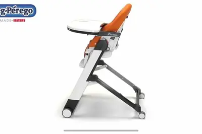 an orange and white desk chair with a glass top at Villa Pacienta in Bonifacio