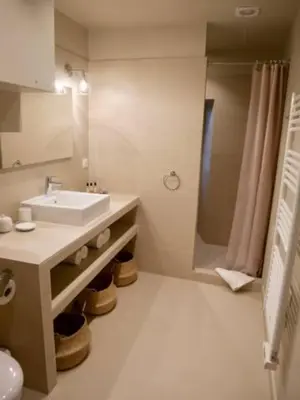 a bathroom with a sink and a shower at Maison Madamicella in Fozzano