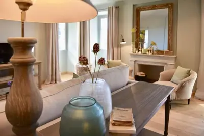 a living room with a couch and a table with vases at Maison Madamicella in Fozzano