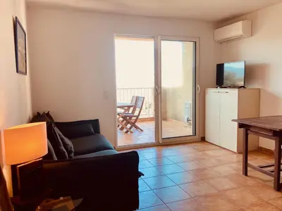 a living room with a couch and a table at Punta di Mare in Linguizzetta