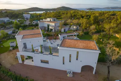 an aerial view of a white house at Villa Blue Pearl 10 pers piscine chauffée 10 minutes plage à pieds in Sainte-Lucie de Porto-Vecchio