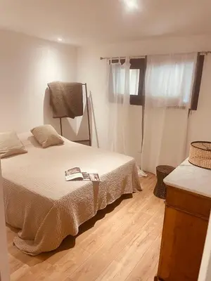 a bedroom with a bed and a window at T3 dans charmante propriété in Borgo