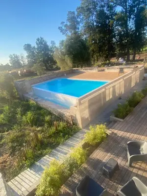 an overhead view of a swimming pool in a backyard at T3 dans charmante propriété in Borgo