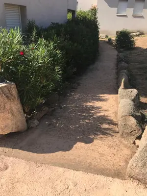 a path in front of a house with some plants at Mini villa proche des plus belles plages in Porto-Vecchio