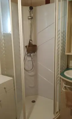 a shower in a small bathroom with a sink at Beach house à Marina di Sorbo …Corse in Sorbo-Ocagnano