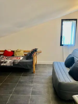 a room with a bed and a couch in it at tytoun evasion in Borgo
