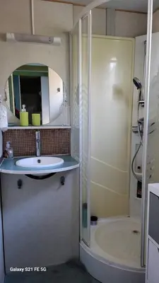 a bathroom with a sink and a shower and a tub at Chalet climatisé avec patio en Haute Corse 5 couchages in Camp du Cap Sud