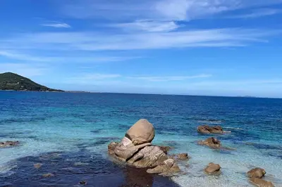 a group of rocks in the water on a beach at Casa Altura in Coti-Chiavari
