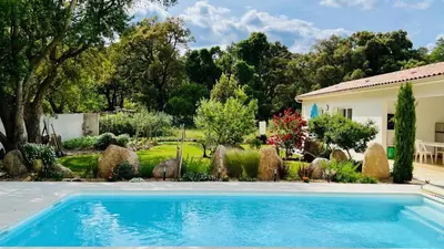 a swimming pool in the yard of a house at Mini Villa Pascal Paoli avec piscine - proche mer in Prunelli-di-Fiumorbo