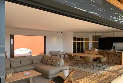 a living room with a couch and a table at Schena Villata in Zonza