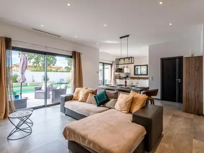 a living room with a couch and a table at Holiday Home Villa les lieges by Interhome in Lecci