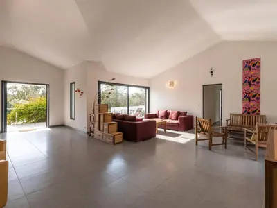 a living room with couches and a table and chairs at Villa Villa Fautea by Interhome in Sainte-Lucie de Porto-Vecchio