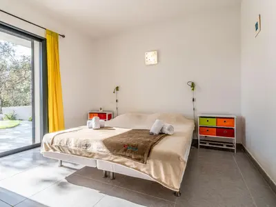 a bedroom with a bed and a dresser and a window at Villa Villa Fautea by Interhome in Sainte-Lucie de Porto-Vecchio
