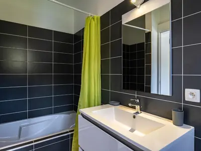 a bathroom with a sink and a mirror at Villa Villa Fautea by Interhome in Sainte-Lucie de Porto-Vecchio