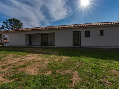 a house with the sun in the sky at Villa Villa Fautea by Interhome in Sainte-Lucie de Porto-Vecchio