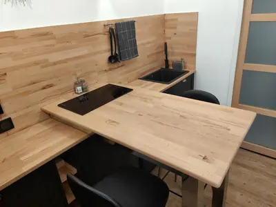 a wooden counter with two sinks and two chairs at Studio rue Fesch in Ajaccio