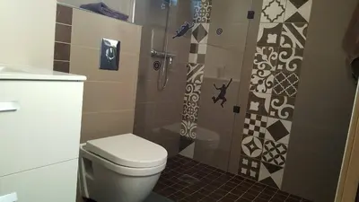 a bathroom with a toilet and a shower at Maison vue mer à 5 minutes à pied de la vieille ville de Porto Vecchio in Porto-Vecchio
