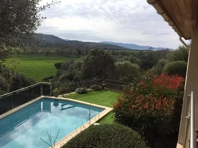 a swimming pool in the yard of a house at LE PALADIN Porto Pollo Villa privée avec piscine chauffée in Serra-di-Ferro