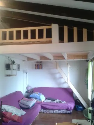 a living room with a bunk bed and a purple couch at Appart 5 personnes a PORTICCIO Avec 2 piscines matériel enfant ,bébé clim in Porticcio