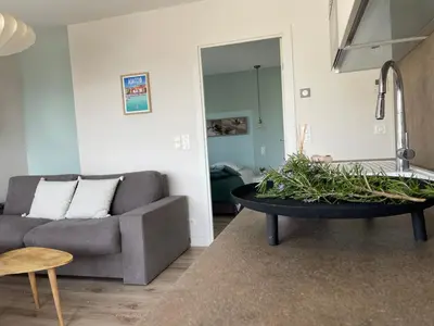 a living room with a couch and a coffee table at La Sté in Porticcio