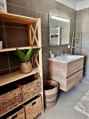 a bathroom with a sink and a mirror at Appartement Agosta Plage in Porticcio