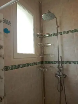 a shower with a window in a bathroom at HAUT VILLA MESANGES EN BORD DE MER ! in Lucciana