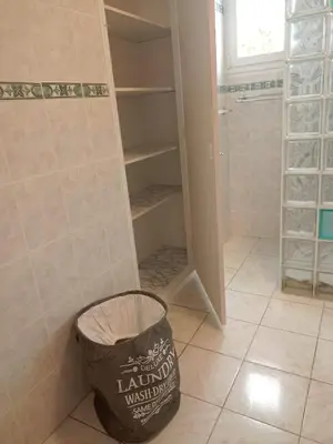 a bathroom with a trash can and a walk in shower at HAUT VILLA MESANGES EN BORD DE MER ! in Lucciana