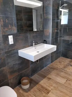 a bathroom with a white sink and a mirror at Casa voscia in Casalabriva