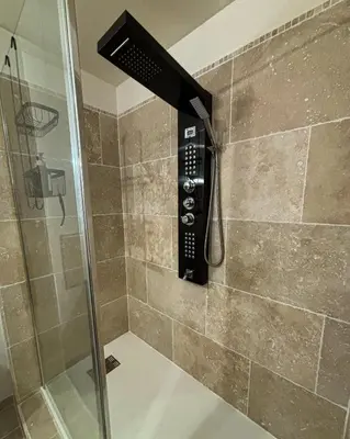 a shower with a phone in a bathroom at Casa Punta Di Vista in Venaco